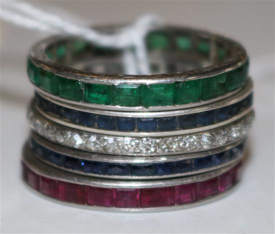 5 eternity rings, sapphires, rubies, onyx, emeralds